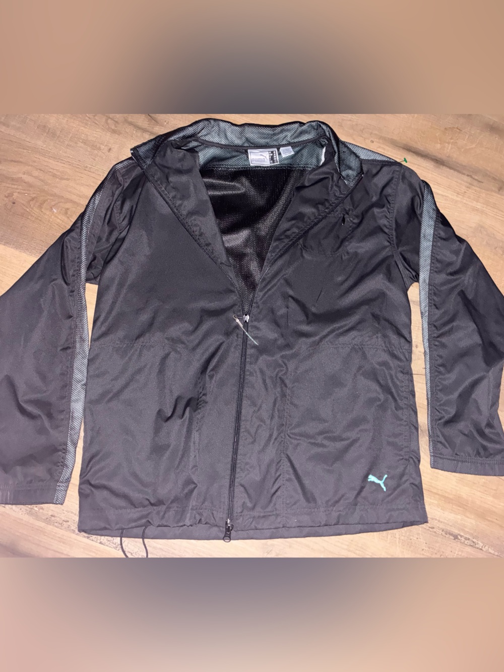 Puma Women’s Black Windbreaker with Teal Logo